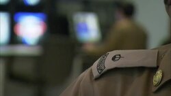Security officers watch security monitors. Stock Footage