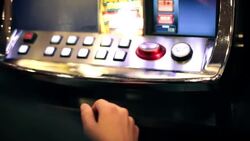 Guy selects button and tries his luck at slot machine Stock Footage