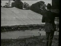 B/W wide shot of people and large tent / Civil War Veterans Reunion / Vicksburg, Mississippi / NO SOUND Stock Footage