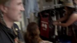 Two young men chat with friendly merchant in Texas ghost town Stock Footage