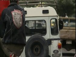 Busy street with cars driving away from camera, Iran (sound available) Stock Footage