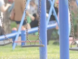 Empty Swing with people background. Stock Footage