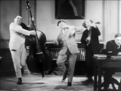 B/W 1936 3 Stooges playing musical instruments in courtroom / feature Stock Footage