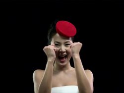 Woman wearing red hat clapping and cheering Stock Footage
