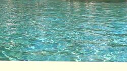 Slow motion footage water in swimming pool Stock Footage