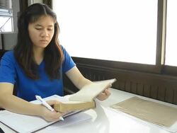 Thai girl student carry book for reading. Stock Footage