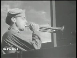 1940s: UNITED STATES NAVY: VS U.S. Navy pilots sitting, crowded, in briefing room, officer pointing to map & talking. VS Crew playing bugle, whistle, speaker on aircraft carrier deck calling to man stations (SOT). WWII, World War II, Pacific Front Instructional Video