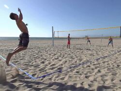 Man serving an ace while playing beach volleyball. - Slow Motion - filmed at 240 fps Stock Footage