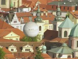 MS AERIAL Shot of air balloon over church / Prague, Czech Republic Stock Footage