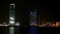 Abu Dhabi skyline at night Stock Footage
