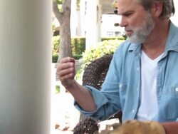 Man with hurt wrist in wide shot Stock Footage