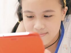 Girl using taplet in bedroom Stock Footage