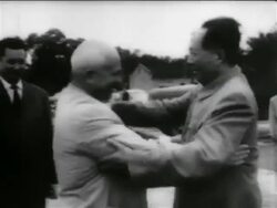 B/W 1950s Khrushchev + Chairman Moa hugging + shaking hands outdoors / newsreel Stock Footage