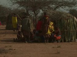 Maasai Ceremony - People outside hut, WITH AUDIO Stock Footage