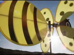 Wasp or bee windmill spinning in wind against blue sky, France, Ardeche Stock Footage