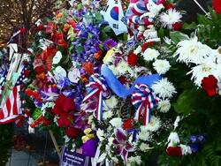 Static shot of flowers and flags at the Korean War Veterans Memorial in Washington DC Stock Footage