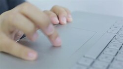 Businesswoman touch on touchpad laptop Stock Footage