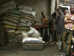 MS Shot of men taking weight of scrap / Lagos, Nigeria Stock Footage