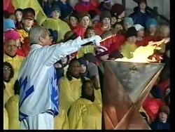 Olympic flame arrives in to fanfare of cheers and fireworks. News Clip