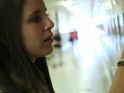 Teen girl opens locker Stock Footage