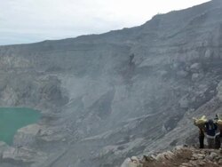 MS Miners climbing the Ijen volcano crater carrying solid sulfur / Ijen, Java, Indonesia Stock Footage