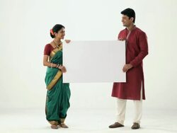 Portrait of a marathi couple showing placard  Stock Footage