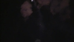 Fireworks explode in the night sky at a Chinese New Year celebration. Stock Footage