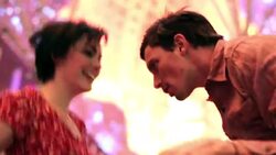 Young couple dance under the bright lights of Fremont Street in downtown Las Vegas Stock Footage