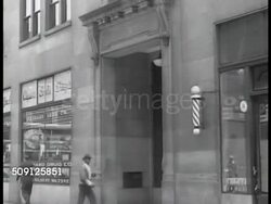 1944: ATLANTA: WS Atlanta, downtown street. EXT Standard building. INT glass door 'Southern Regional Council, Inc.' INT People seated at table. Dr. Reed & Dr. Johnson at table. Pamphlet cover 'Needed...A Southern Charter for Race /Relations' Instructional Video