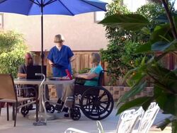 Health care worker with two people Stock Footage