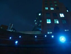 Wide Shot static - Blue LED lights blink on and off next to a high-rise building. / Cambridge, MA Stock Footage