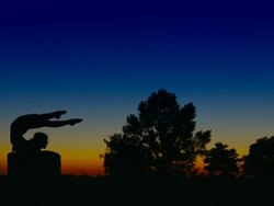 Acrobat girl exercising on column in the evening  Scorpio position Stock Footage