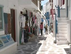 MS ZO Tourist doing shoping at narrow walkway / Myconos, Cylades Islands, Greece Stock Footage