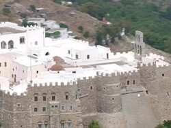 MS DS AERIAL Shot of monastery with ocean / Patmos, Cyclades, Greece Stock Footage