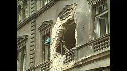 Siege of Sarajevo during Bosnian War - People sitting in Sarajevo cafes next to destroyed buildings News Clip