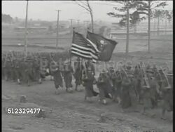 1918: WWI US SOLDIERS DEPLOY:  HA WS Soldiers marching on rural road, flag bearers carrying US Flag & US Marines logo flag. PAN Many cheering soldiers waving hats. WS Soldiers walking up ship's ramp. Sailor handing something to boarding soldiers. Instructional Video