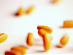 Falling Orange Pills Stock Footage