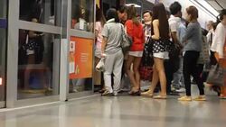 Crowded people in the mass public transportation using their phone while waiting Stock Footage