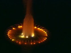 Aerial ECU fountain at night, with orange and yellow lights in water, Century City / Beverly Hills, California, United States. Stock Footage