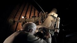 Old man in observatory Stock Footage