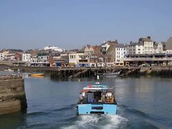 HARBOUR ENTRANCE AND PLEASURE BOAT RIDES Stock Footage
