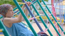 boy doing exercise on the playground Stock Footage