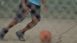 A young man basketball player practicing his ball handling. - Slow Motion Stock Footage