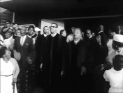 B/W 1963 Black clergy exiting church in civil rights demonstration / Alabama / newsreel Stock Footage