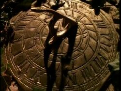 T/L Sundial, with ivy around edges, shadow moves around timepiece Stock Footage