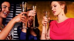 Three women clinking champagne glasses Stock Footage