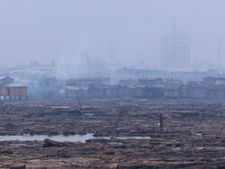 WS Boy with net walking on logs / Lagos, Nigeria Stock Footage