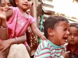 One rural Indian boy crying among the group of children Stock Footage