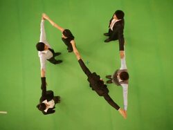 Business people forming alphabet T Stock Footage