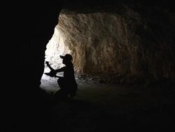 Female explorer is surveying the cave Stock Footage